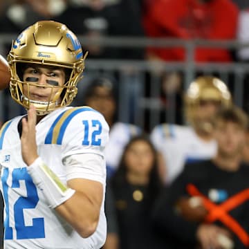 Nov 15, 2025; Columbus, Ohio, USA;  UCLA Bruins quarterback Luke Duncan (12) drops back to throw during the first quarter against the Ohio State Buckeyes at Ohio Stadium. Mandatory Credit: Joseph Maiorana-Imagn Images