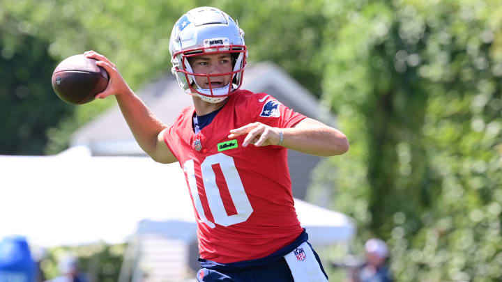 Jul 26, 2024; Foxborough, MA, USA; New England Patriots quarterback Drake Maye (10) throws a pass during training camp at Gillette Stadium. Mandatory Credit: Eric Canha-USA TODAY Sports