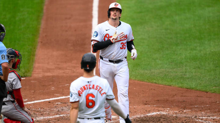 Aug 18, 2024; Baltimore, Maryland, USA; Baltimore Orioles catcher Adley Rutschman (35) reacts after hitting a home run during the fifth inning against the Boston Red Sox at Oriole Park at Camden Yards. Mandatory Credit: Reggie Hildred-USA TODAY Sports