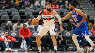 Oct 18, 2024; Washington, District of Columbia, USA; Washington Wizards center Jonas Valanciunas (17) dribbles the ball while being defended by New York Knicks center Karl-Anthony Towns (32) during the first quarter at Capital One Arena. Mandatory Credit: Reggie Hildred-Imagn Images