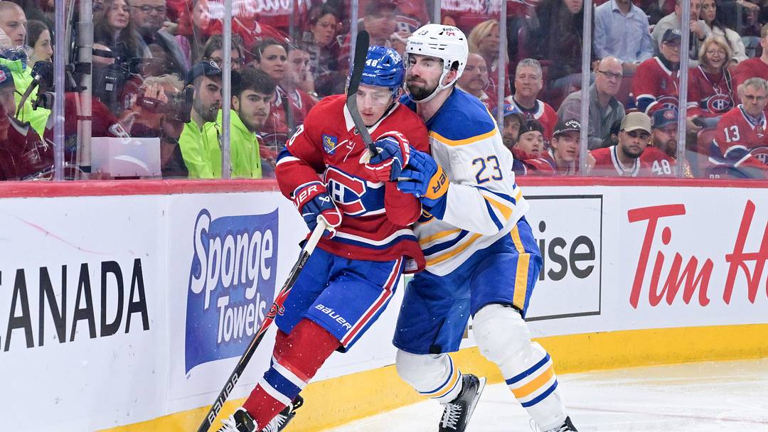 May 12, 2026; Montreal, Quebec, CAN; Montreal Canadiens defenseman Lane Hutson (48) plays the puck and Buffalo Sabres defenseman Mattias Samuelsson (23) defends during the third period in game four of the second round of the 2026 Stanley Cup Playoffs at Bell Centre. Mandatory Credit: Eric Bolte-Imagn Images