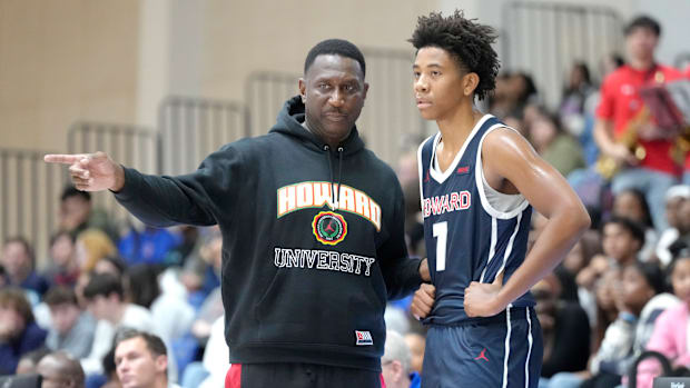 Howard coach Kenny Blakeney talks to Blake Harper during an exhibition college basketball game in October.