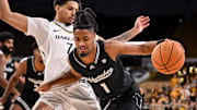 UW-Milwaukee Panthers guard Themus Fulks (1) drives to the basket against Oakland Golden Grizzlies guard Isaiah Jones (7) during the second half in a game Thursday, February 27, 2025, at the UWM Panther Arena in Milwaukee, Wisconsin. UWM won, 71-66.