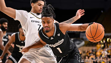 UW-Milwaukee Panthers guard Themus Fulks (1) drives to the basket against Oakland Golden Grizzlies guard Isaiah Jones (7) during the second half in a game Thursday, February 27, 2025, at the UWM Panther Arena in Milwaukee, Wisconsin. UWM won, 71-66.