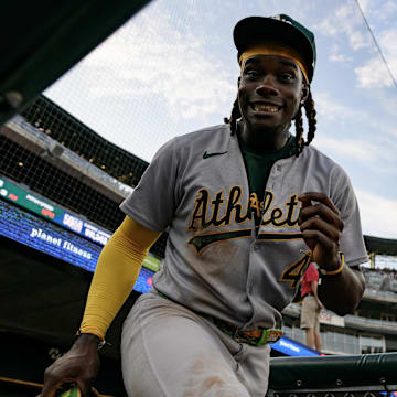 Jun 25, 2025; Detroit, Michigan, USA; Athletics right fielder Lawrence Butler (4) mocks for the camera as he takes the field for the fifth inning against the Detroit Tigers at Comerica Park. Mandatory Credit: Lon Horwedel-Imagn Images
