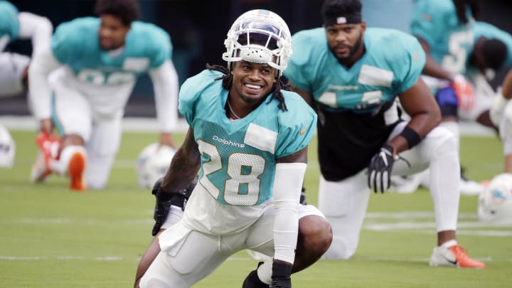 Aug 29, 2020; Miami Gardens, Florida, United States;  Miami Dolphins safety Bobby McCain (28) stretches during training camp at Hard Rock Stadium.