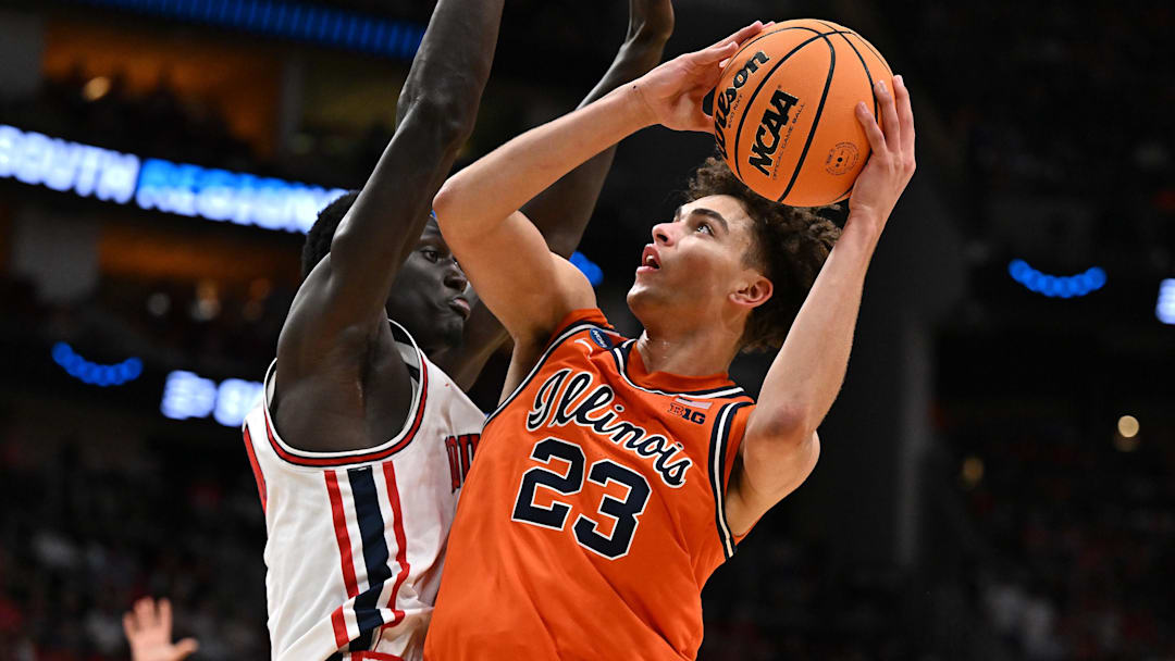 Mar 26, 2026; Houston, TX, USA; Illinois Fighting Illini guard Keaton Wagler (23) shoots the ball against Houston Cougars forward Kalifa Sakho (14) in the second half during the Sweet Sixteen.