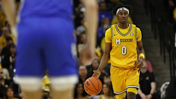 Missouri Tigers guard Anthony Robinson II (0) dribbles down the court, in a game against the Kentucky Wildcats this season.
