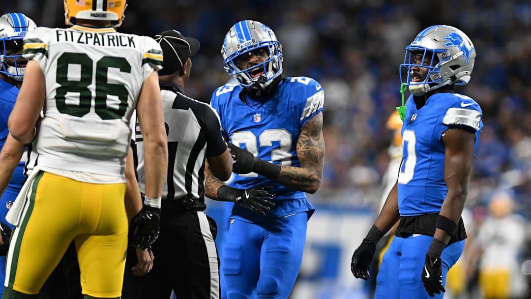 Dec 5, 2024; Detroit, Michigan, USA;  Detroit Lions cornerback Carlton Davis III (23) and Green Bay Packers tight end John FitzPatrick (86) exchange words in the second quarter at Ford Field. Mandatory Credit: Lon Horwedel-Imagn Images