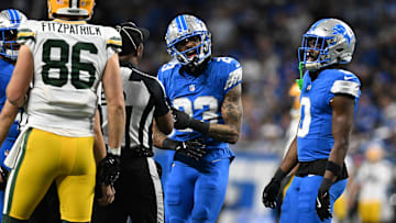 Dec 5, 2024; Detroit, Michigan, USA;  Detroit Lions cornerback Carlton Davis III (23) and Green Bay Packers tight end John FitzPatrick (86) exchange words in the second quarter at Ford Field. Mandatory Credit: Lon Horwedel-Imagn Images