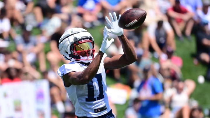 Jul 26, 2024; Foxborough, MA, USA; New England Patriots wide receiver Tyquan Thornton (11) makes a catch during training camp at Gillette Stadium. Mandatory Credit: Eric Canha-USA TODAY Sports