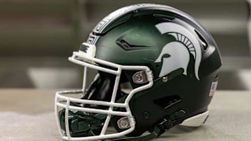 Nov 24, 2023; Detroit, Michigan, USA; A Michigan State Spartans helmet sits on a bench during the second half game against the Penn State Nittany Lions at Ford Field. Mandatory Credit: David Reginek-Imagn Images
