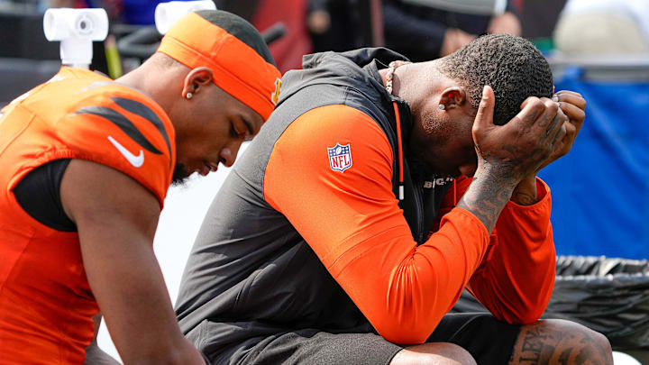 Cincinnati Bengals Ja'Marr Chase and Tee Higgins who was inactive for the Bengals sit on the sideline as their team is defeated by the New England Patriots 16-10 at Paycor Stadium Sunday, September 8, 2024.