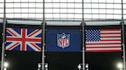 British, NFL and American flags fly before a 2024 NFL game in London.