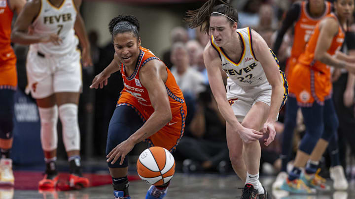Connecticut Sun forward Alyssa Thomas (25) knocks the ball away from Indiana Fever guard Caitlin Clark (22) during the second half of an WNBA basketball game, Monday, May 20, 2024, at Gainbridge Fieldhouse. Connecticut Sun forward Alyssa Thomas (25) knocks the ball away from Indiana Fever guard Caitlin Clark (22) during the second half of an WNBA basketball game, Monday, May 20, 2024, at Gainbridge Fieldhouse.