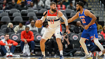 Oct 18, 2024; Washington, District of Columbia, USA; Washington Wizards center Jonas Valanciunas (17) dribbles the ball while being defended by New York Knicks center Karl-Anthony Towns (32) during the first quarter at Capital One Arena. Mandatory Credit: Reggie Hildred-Imagn Images