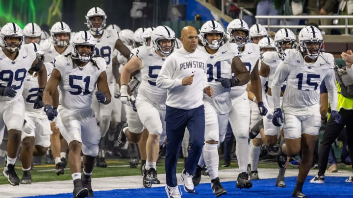 Penn State football coach James Franklin leads the Nittany Lions onto the field before a game against Michigan State at Ford Field in Detroit. 