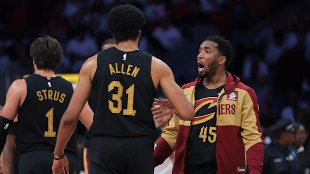 Cleveland Cavaliers guard Donovan Mitchell (45) celebrates with center Jarrett Allen (31) against the Miami Heat