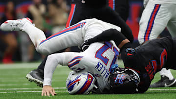 Oct 6, 2024; Houston, Texas, USA;  Buffalo Bills quarterback Josh Allen (17) gets hit by Houston Texans safety Jalen Pitre (5) in the second half at NRG Stadium.