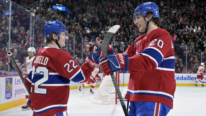 Apr 16, 2024; Montreal, Quebec, CAN; Montreal Canadiens forward Cole Caufield (22) celebrates with forward Juraj Slafkovsky (20) after scoring a goal against the Detroit Red Wings during the second period at the Bell Centre. Mandatory Credit: Eric Bolte-USA TODAY Sports