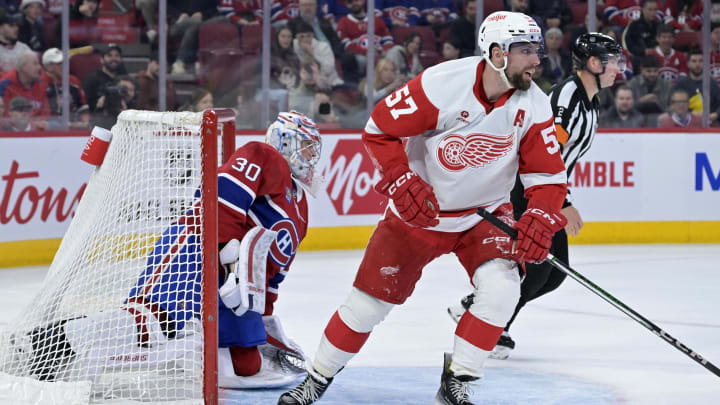 Apr 16, 2024; Montreal, Quebec, CAN; Detroit Red Wings forward David Perron (57) and Montreal Canadiens goalie Cayden Primeau (30) during the third period at the Bell Centre. Mandatory Credit: Eric Bolte-USA TODAY Sports