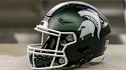 Nov 24, 2023; Detroit, Michigan, USA; A Michigan State Spartans helmet sits on a bench during the second half game against the Penn State Nittany Lions at Ford Field. Mandatory Credit: David Reginek-Imagn Images