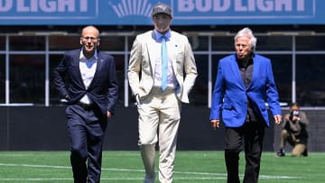Apr 26, 2024; Foxborough, MA, USA; New England Patriots quarterback Drake Maye (center) walks with