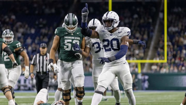 Penn State Nittany Lions defensive end Adisa Isaac (20) celebrates a sack of Michigan State Spartans quarterback Katin Houser (12) during the second half at Ford Field. 