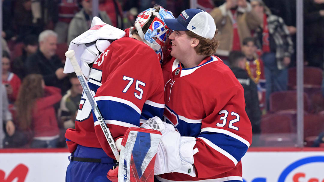 Mar 26, 2026; Montreal, Quebec, CAN; Montreal Canadiens goalie Jakub Dobes (75) celebrates the win against the Columbus Blue Jackets with teammate goalie Jacob Fowler (32) at the Bell Centre. Mandatory Credit: Eric Bolte-Imagn Images