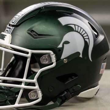 Nov 24, 2023; Detroit, Michigan, USA; A Michigan State Spartans helmet sits on a bench during the second half game against the Penn State Nittany Lions at Ford Field. Mandatory Credit: David Reginek-USA TODAY Sports