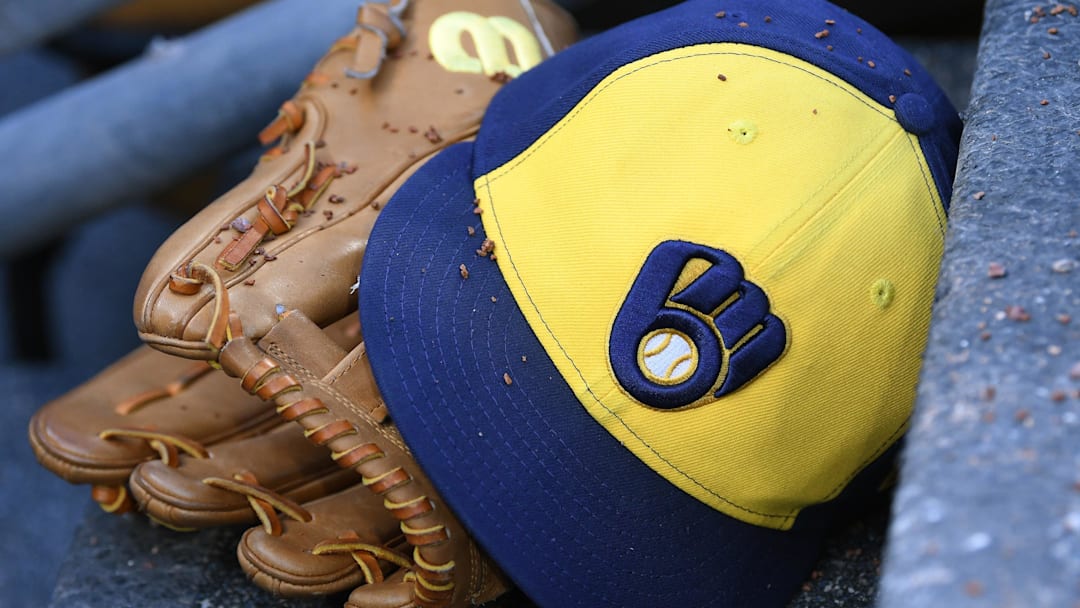 Apr 22, 2026; Detroit, Michigan, USA;  Milwaukee Brewers right fielder Sal Frelick (10) glove and hat sit on the Brewers dugout steps covered in infield dirt during their game against the Detroit Tigers at Comerica Park. Mandatory Credit: Lon Horwedel-Imagn Images
