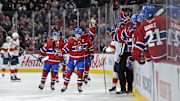 Apr 1, 2025; Montreal, Quebec, CAN; Montreal Canadiens forward Nick Suzuki (14) celebrates with teammates after scoring a goal against the Florida Panthers during the third period at the Bell Centre. Mandatory Credit: Eric Bolte-Imagn Images