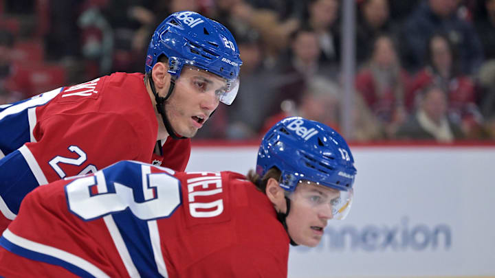 Apr 7, 2026; Montreal, Quebec, CAN; Montreal Canadiens forward Juraj Slafkovsky (20) and teammate forward Cole Caufield (13) prepare for a face off  against the Florida Panthers during the first period at the Bell Centre. Mandatory Credit: Eric Bolte-Imagn Images