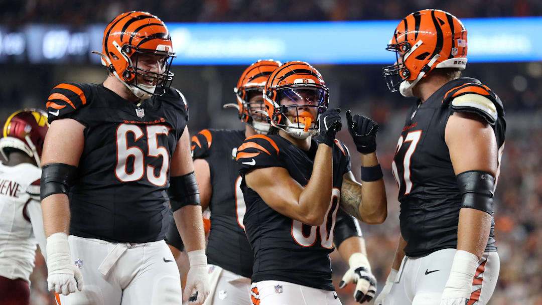 Sep 23, 2024; Cincinnati, Ohio, USA; Cincinnati Bengals wide receiver Andrei Iosivas (80) celebrates a touchdown with guard Alex Cappa (65) and guard Cordell Volson (67) during the third quarter against the Washington Commanders at Paycor Stadium. Mandatory Credit: Joseph Maiorana-Imagn Images