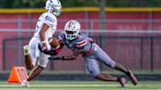 Fishers High School senior Carsen Eloms (2) dives for a pass intended of Franklin Central High School senior Jayvyn McKinley (5) during the first half of an IHSAA varsity football game, Friday, Oct. 3, 2025, at Fishers High School.