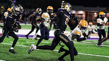 Booker's Chauncey Kennon runs upfield during the Class 3A-Region 3 Final against Boca Ciega in Sarasota on Friday, Nov. 29, 2024. Booker won 41-6.
