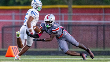 Fishers High School senior Carsen Eloms (2) dives for a pass intended of Franklin Central High School senior Jayvyn McKinley (5) during the first half of an IHSAA varsity football game, Friday, Oct. 3, 2025, at Fishers High School.