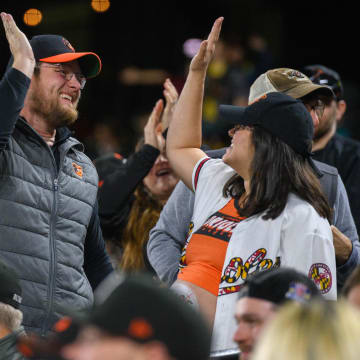 Apr 26, 2024; Baltimore, Maryland, USA; Baltimore Orioles fans celebrate at Oriole Park at Camden Yards. 