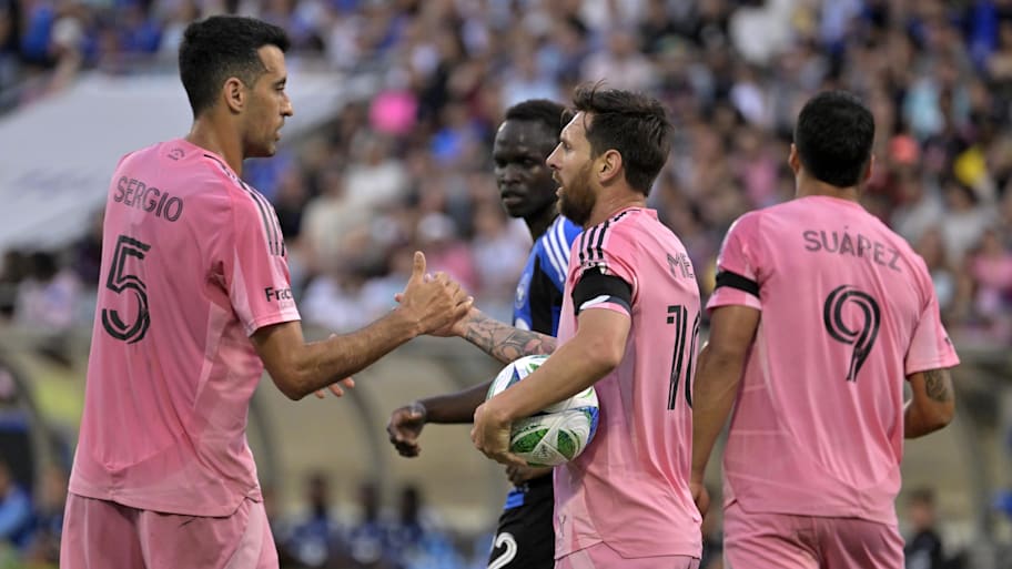 Sergio Busquets (5) and teammates forward Lionel Messi (10) and forward Luis Suarez (9) celebrate a goal against CF Montreal during the first half at Saputo Stadium. | Eric Bolte-Imagn Images