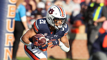 Nov 25, 2023; Auburn, Alabama, USA;  Auburn Tigers running back Brian Battie (21) returns a kick