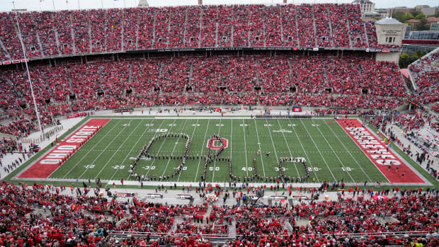 Band marches Script Ohio on the field.