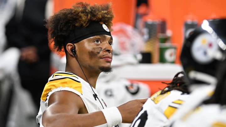 Steelers quarterback Justin Fields looks at the scoreboard while sitting on the bench during the Steelers preseason game  against the Lions at Ford Field.