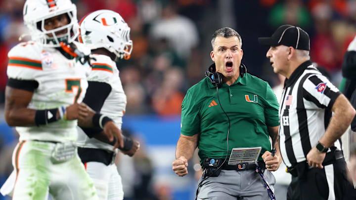 Jan 8, 2026; Glendale, AZ, USA; Miami Hurricanes head coach Mario Cristobal reacts in the second half during the 2026 Fiesta Bowl and semifinal game of the College Football Playoff at State Farm Stadium. Mandatory Credit: Mark J. Rebilas-Imagn Images