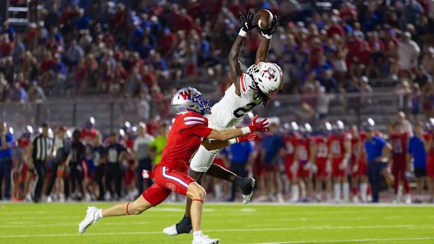 Atascosita's Ta'von Bolden (25) intercepts a pass intended for Lawson Grimes (1) late in a 39-21 upset of Austin Westlake.