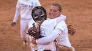 Texas A&M catcher Julia Cottrill (42) hugs pitcher Emiley Kennedy (11) after beating Texas in the NCAA Super Regional opener at Red & Charline McCombs Field on Friday, May 24, 2024 in Austin.