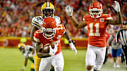 Kansas City Chiefs wide receiver Mecole Hardman (17) scores as Green Bay Packers strong safety Adrian Amos (31) pursues.