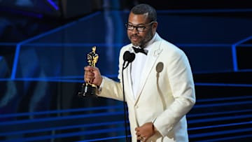 Jordan Peele accepts the Oscar for Original Screenplay for \"Get Out\" during the 90th Academy Awards.