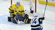 Feb 15, 2025; Montreal, Quebec, CAN; [Imagn Images direct customers only] Team Finland forward Mikael Granlund (64) scores the winning goal against Team Sweden goalie Linus Ullmark (35) in the overtime period during a 4 Nations Face-Off ice hockey game at the Bell Centre. Mandatory Credit: Eric Bolte-Imagn Images