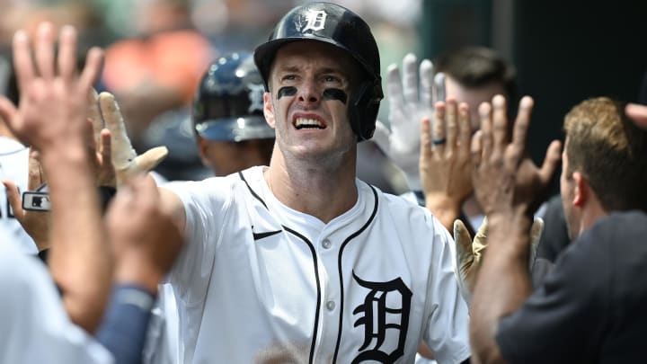 Jun 9, 2024; Detroit, Michigan, USA;  Detroit Tigers designated hitter Mark Canha (21) celebrates in the dugout after scoring a run  against the Milwaukee Brewers in the first inning at Comerica Park. Mandatory Credit: Lon Horwedel-USA TODAY Sports