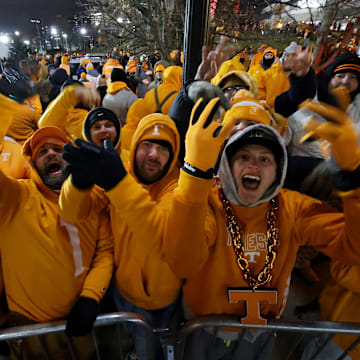 Tennessee Volunteers fans gather to watch the team arrive before the game against the Ohio State Buckeyes at Ohio Stadium. 